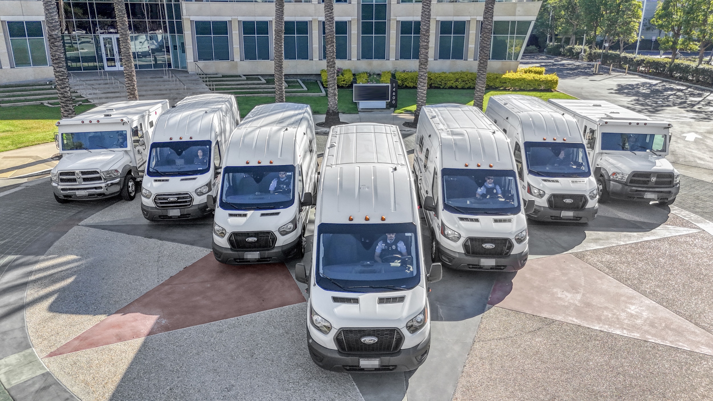 Fleet of delivery trucks in parking lot